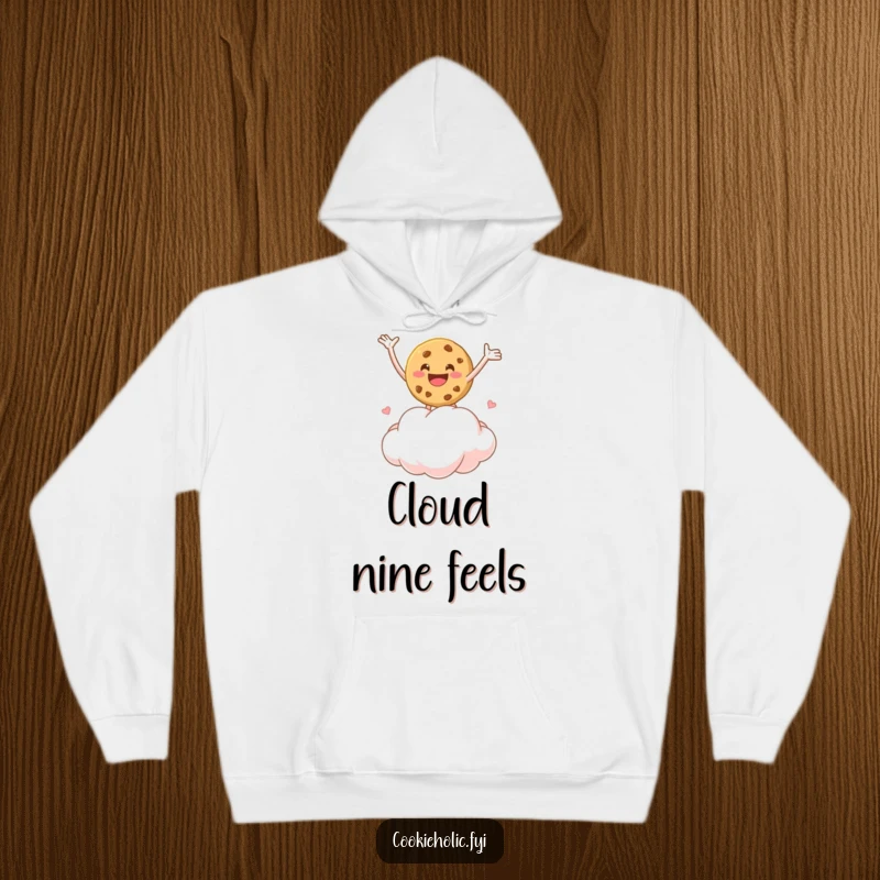 Funny hoodie featuring a cookie character bouncing joyfully on a marshmallow cloud, providing warmth and cheerful vibes.